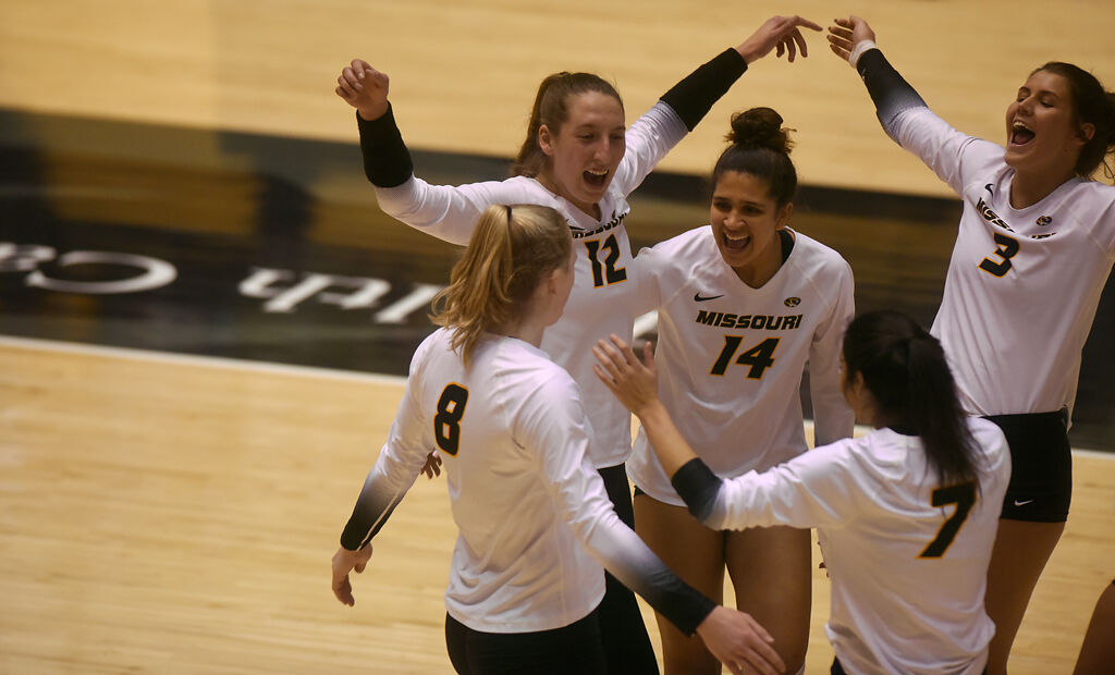 The Missouri volleyball team celebrates their victory